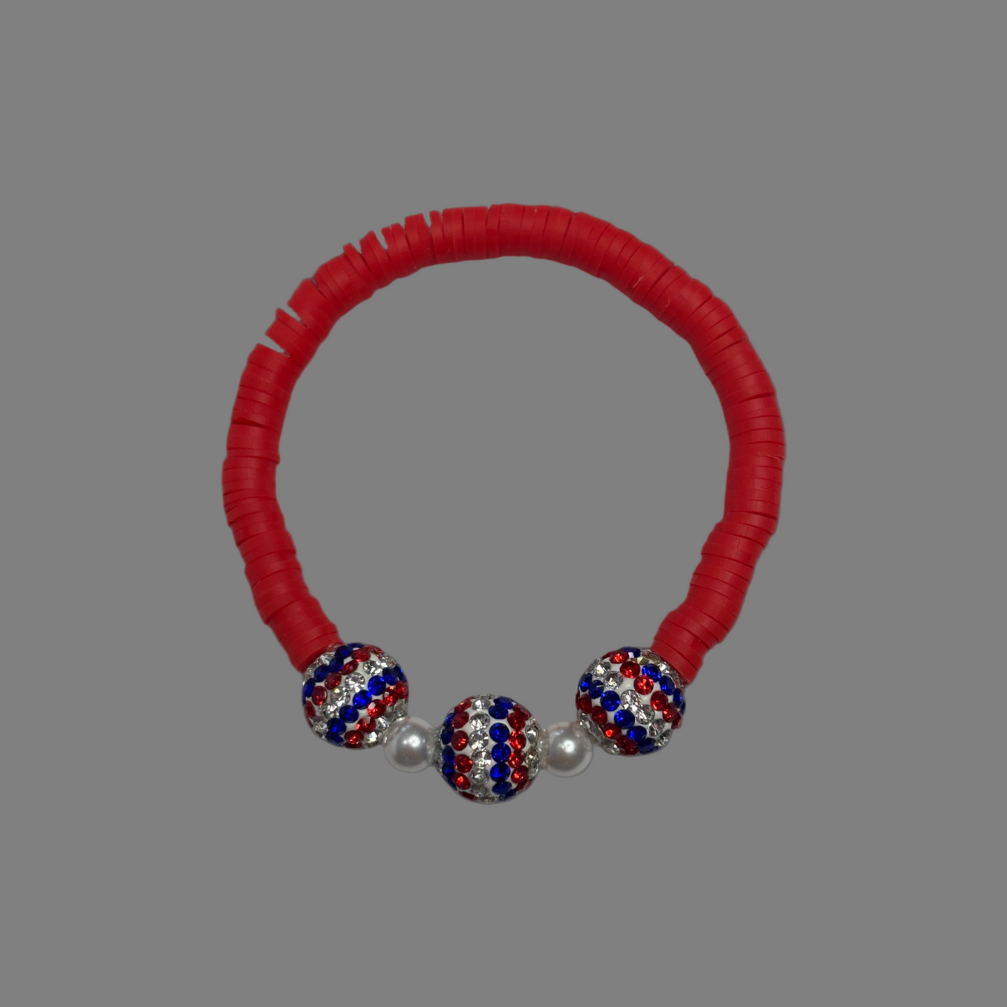 Red White & Blue stretch bracelet sparkles and shines patriotism.  It definitely is a sign of love for our Country.  Made with red clay beads 3 beautiful national color beads and 2 silver plated beads.   Fits up to size 7 wrist. 