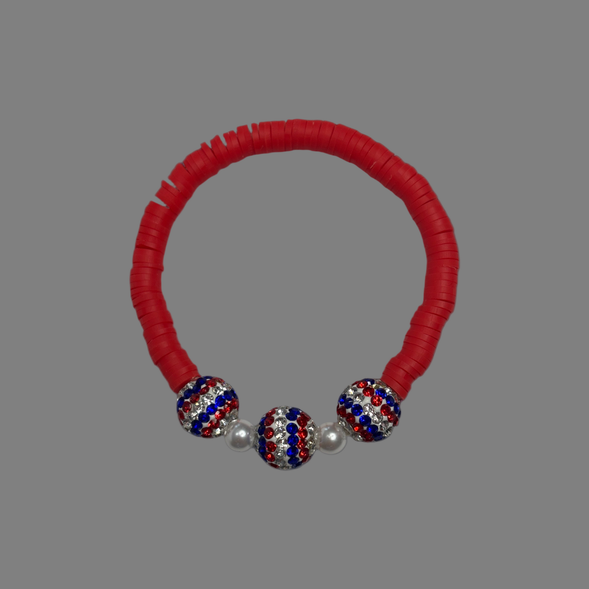 Red White & Blue stretch bracelet sparkles and shines patriotism.  It definitely is a sign of love for our Country.  Made with red clay beads 3 beautiful national color beads and 2 silver plated beads.   Fits up to size 7 wrist. 