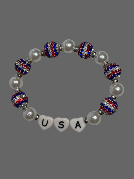 USA bracelet is handmade with plastic pearl beads, connected to red, white & blue sparkly and shiny ball beads.   
